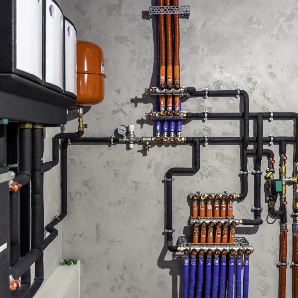 A modern electric boiler room. Equipment for modern heating system as a boiler, heater,pipes, expansion tank and other.