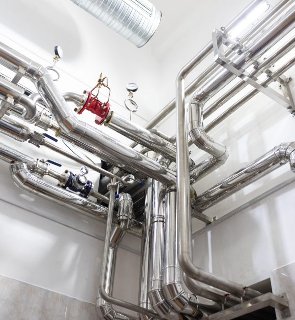 Modern industry equipment, cables and piping inside in manufacture background